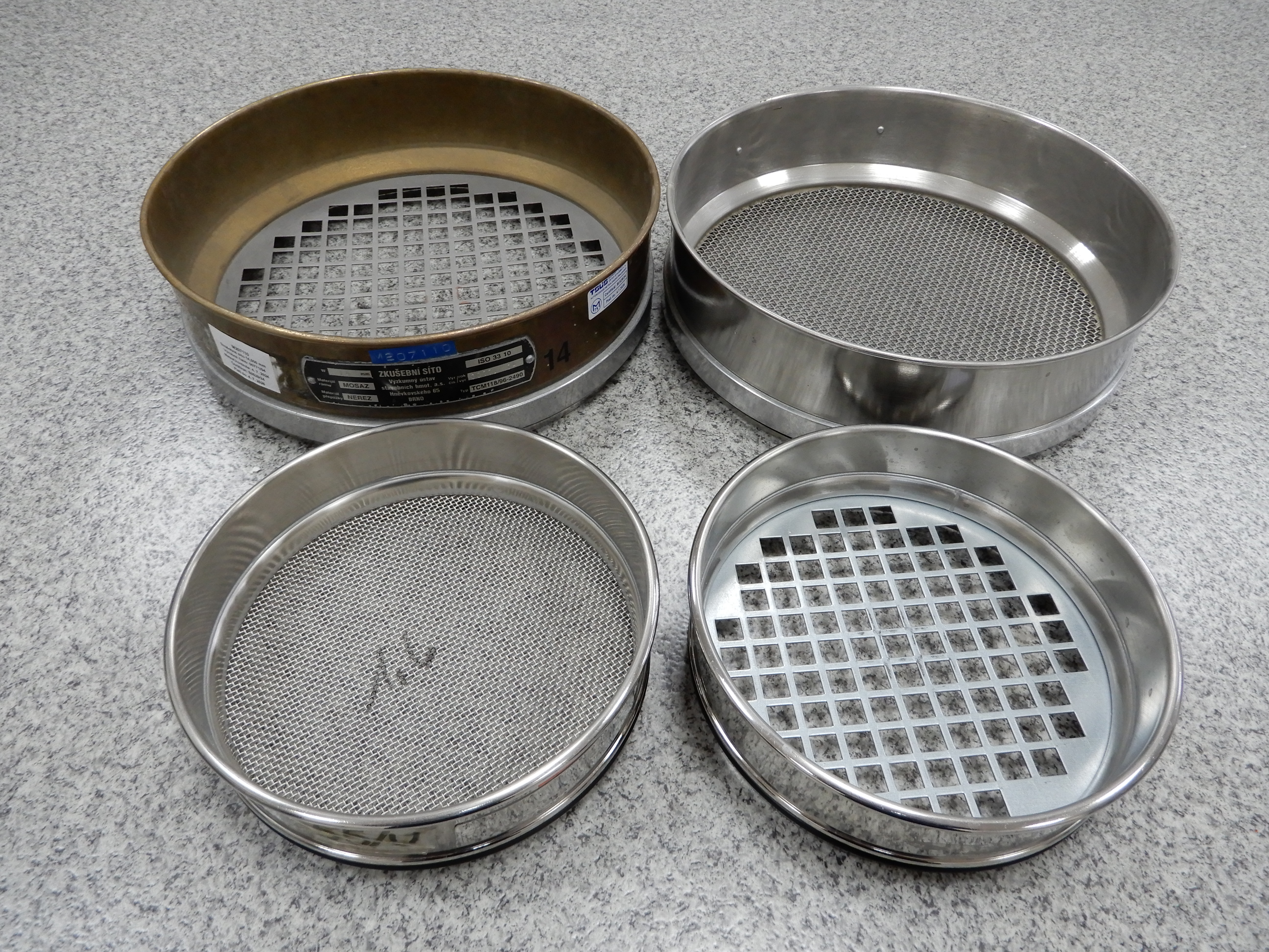 Test sieves made of perforated metal plate and woven wire cloth
